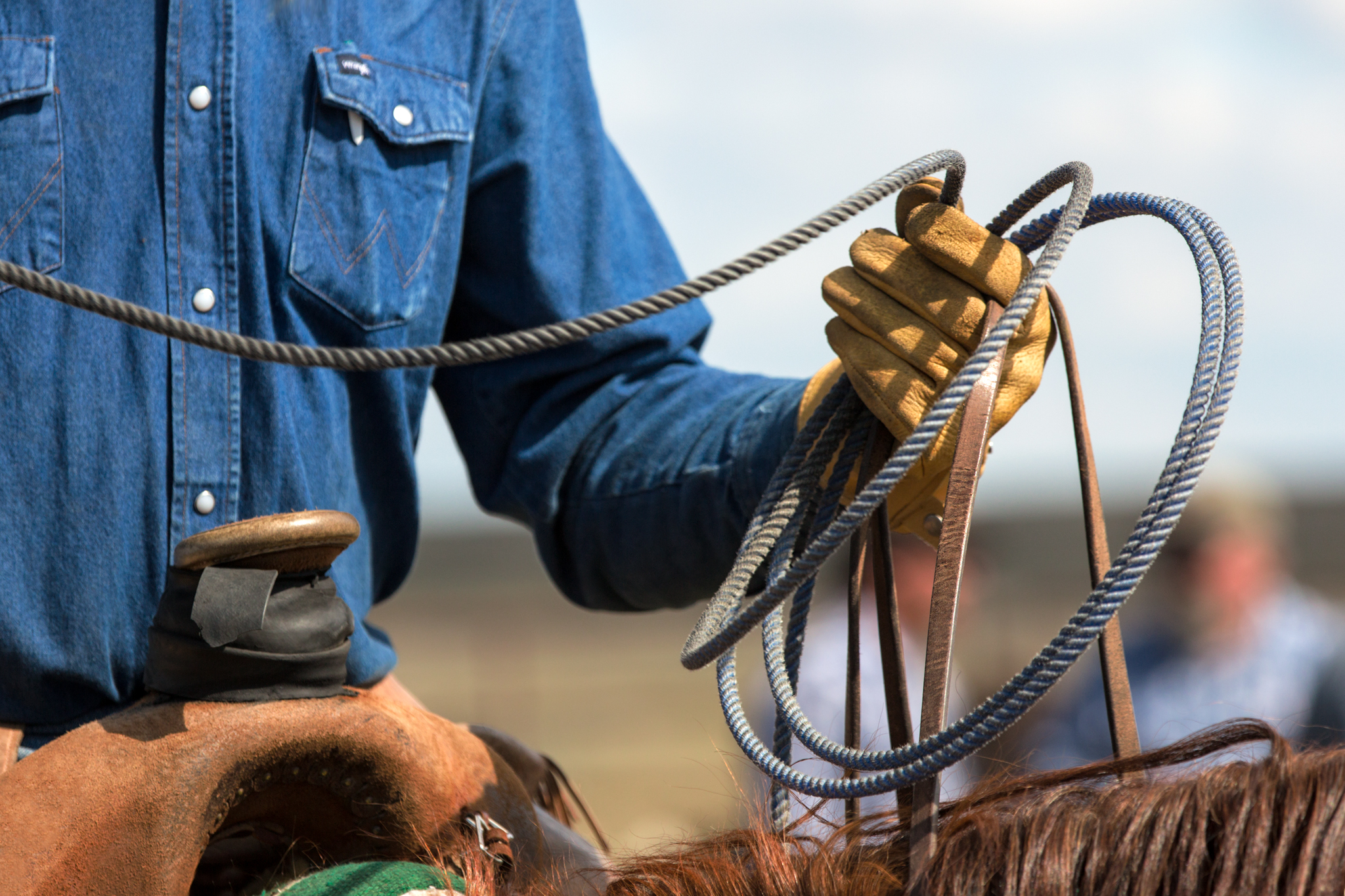Up close image cowboy hands with rope photo by Todd Klassy