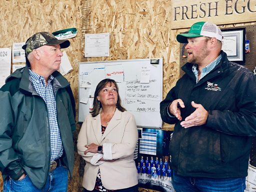 Gov. Gianforte and Dir. Clark talking with Alex Verlanic at Farmer Boy Eggs in Drummond