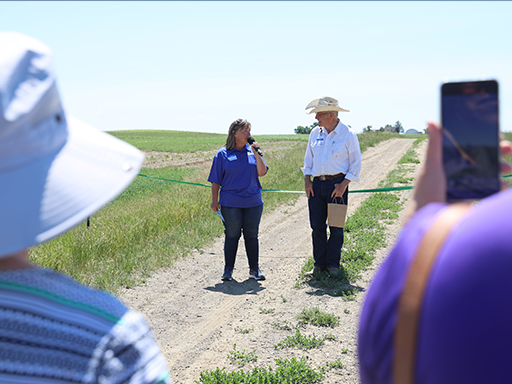 Director Clark speaking to the crowd with Bob Quinn at the Quinn Institute in Big Sandy